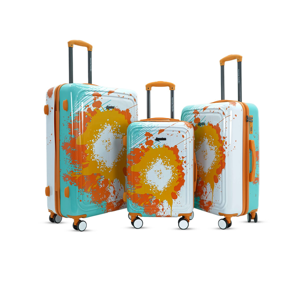 Designer hard shell suitcase set with bold orange splash pattern, 360-degree spinner wheels, and telescopic trolley handles