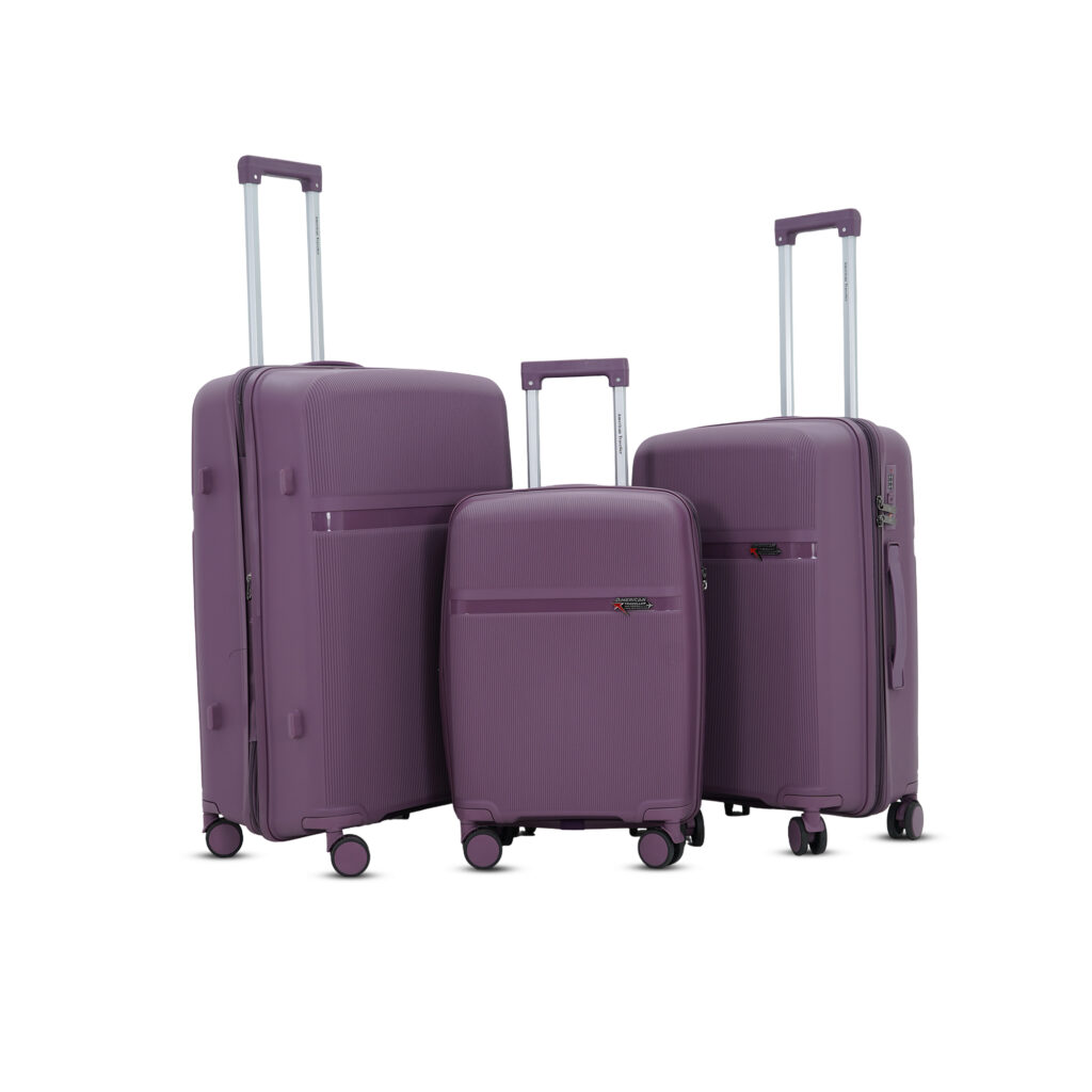 Purple hard luggage trolley bag set from American Traveller, featuring three durable suitcases with telescopic handles and 360° wheels