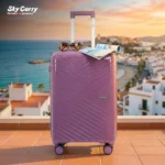Specta Lavender Violet Suitcase in Seaside Building from American Traveller Trolley Bags India